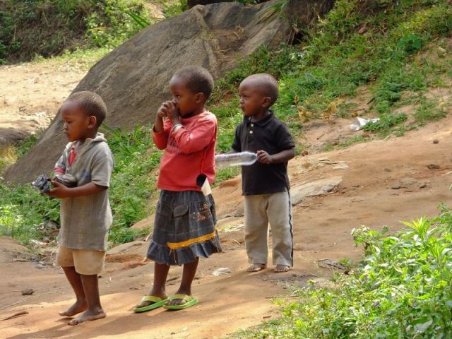 These kids weren't quite sure about those foreigners. 