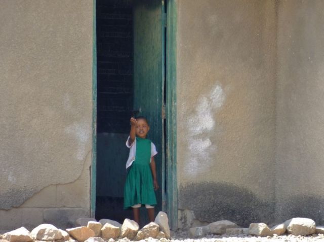 Little girl waving at us as we leave the Headquarters of Ruaha Park