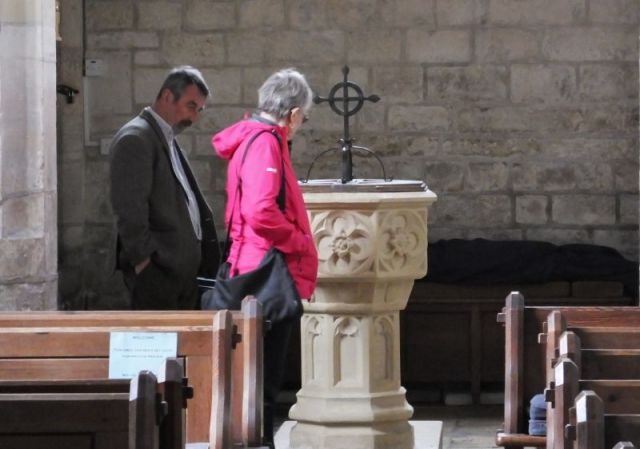 Doris and Steve checking out the 15th century stone font.
