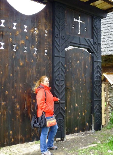 Our guide Cornelia explains the tree of life designs on this wooden gate
