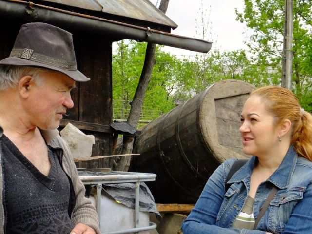 Cornelia translating a question or an answer for us.  There were many questions for us from the foursome. Not just questions from us to our hosts.