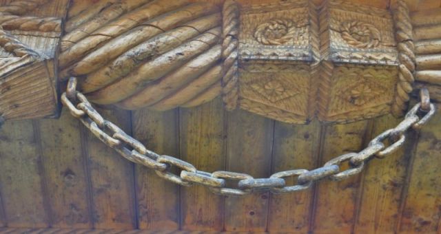 A wooden chain we saw hanging on someone's wooden gate.