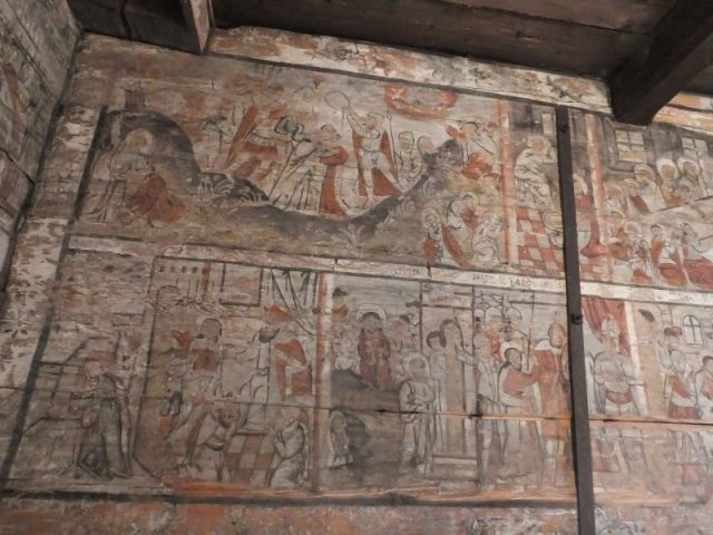 Faded paintings that covered the church walls
