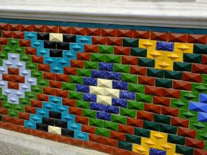 We saw these decorative tiles on the side of many houses.