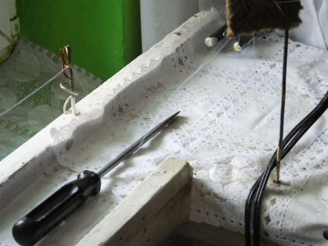 The thread running to the sewing machine