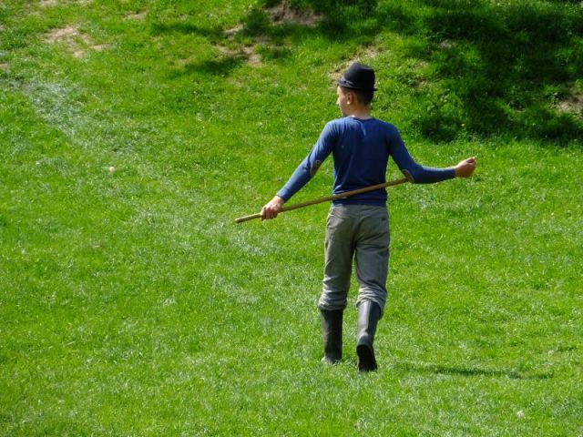 One of the boys walking back to the house