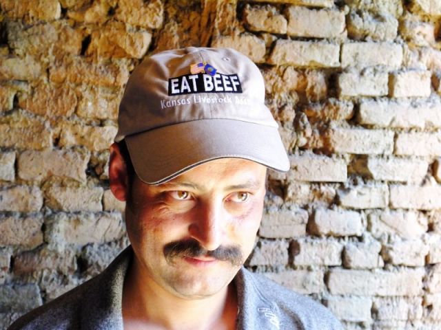 Sporting his new cap with the hat pin.