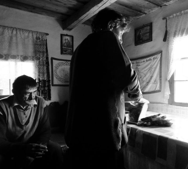 Slicing bread. Why Black and white photos? Because the light coming in the windows was so harsh my color photos were not good. I let the computer change them to black and white to try and salvage them