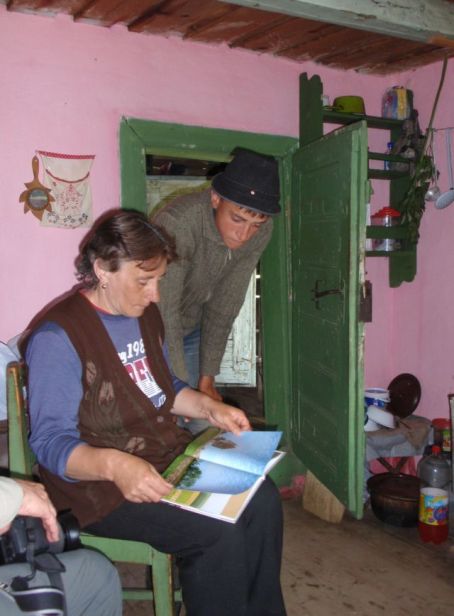 Ileana and Gabi (I think) looking at our photo book. Paul's photo