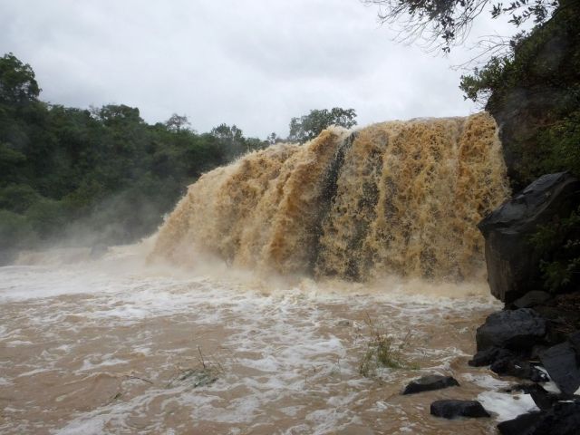 The roaring, muddy waterfall