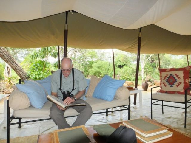 The lounge area next to the mess tent. They had lots of old books on Africa and Meru and other books that people left there.