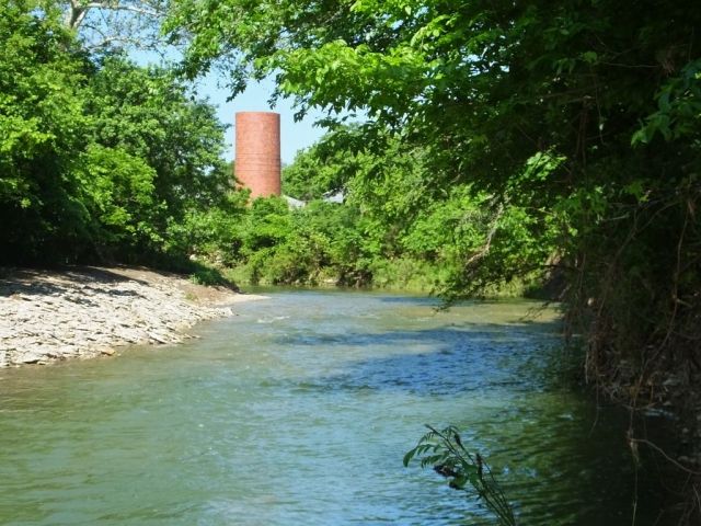 Our creek still somewhat high but when it was at its peak all the rock on the other side would have been under water. Where I stood to take the photo, I would have been in water to my waist when the creek was raging.