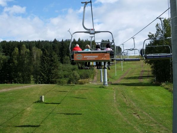 Some of our party heading up the mountain on the ski lift