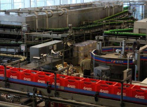 Robots at work with one human overseeing this area