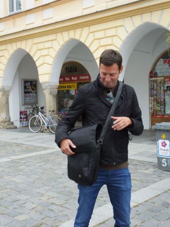 Milan with a pleased smile on his face as he is ready to pull a treat from his magic bag!