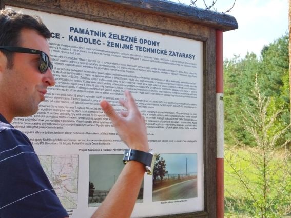 Milan explaining what the sign says and relating the story of his parents when the iron curtain came down