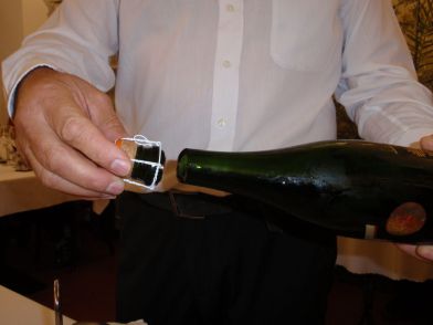 To open the wine bottle, Pavel took a long sword and whacked the top off. It was quite impressive. Paul's photo