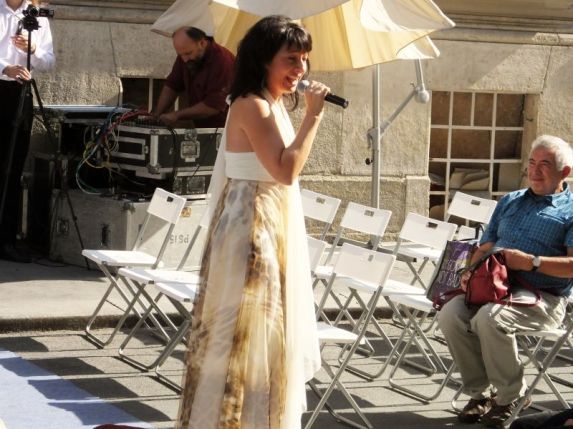 Woman singing at festival taking place by our hotel